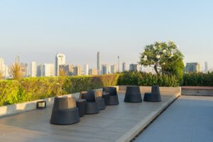 Sky garden on private rooftop of condominium or hotel, high rise architecture building, grass field