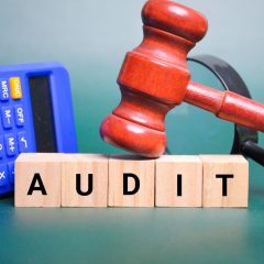 gavel and calculator with the word audit.