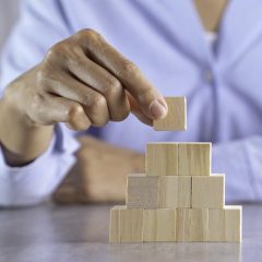 hand stack woods block step on table. business development concept.copy space.