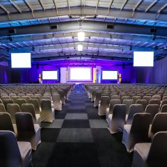 Rows of empty chairs in the large conference hall for corporate convention or lecture