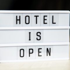 White lightbox with greeting text message Hotel is open. End of quarantine concept.